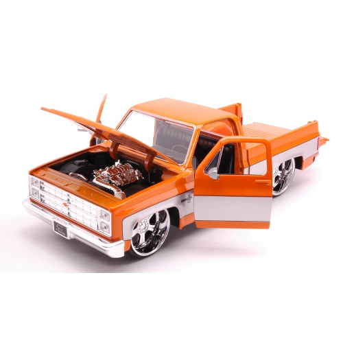 CHEVROLET C-10 PICK UP 1985 ORANGE/GREY 1:24 Jada Toys Movie Modellino